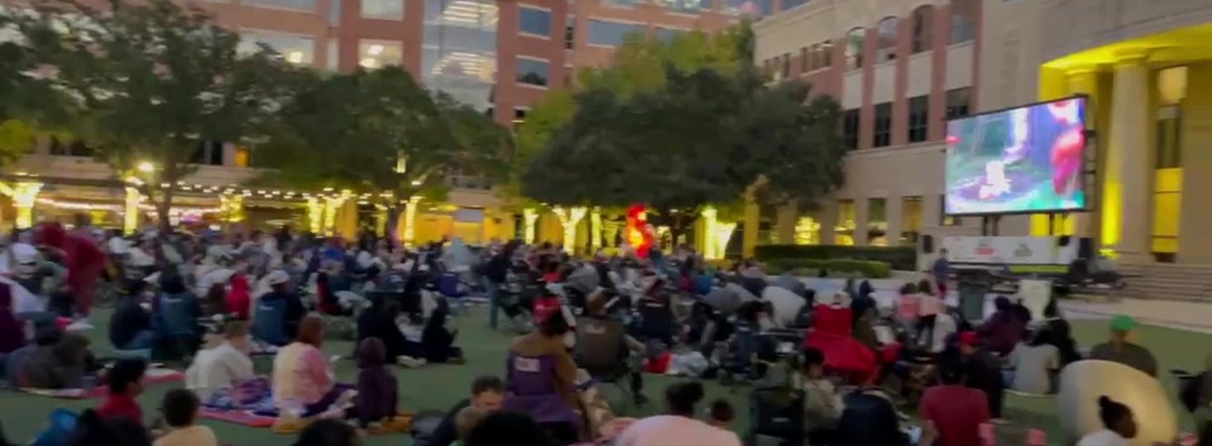 Crowd watching an outdoor movie on the LED screen